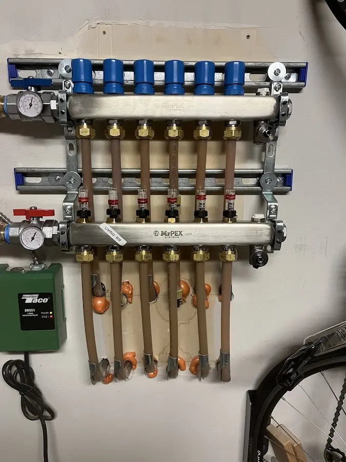 Plumber performing Water Heater Repair at a residential property in Lake Goodwin